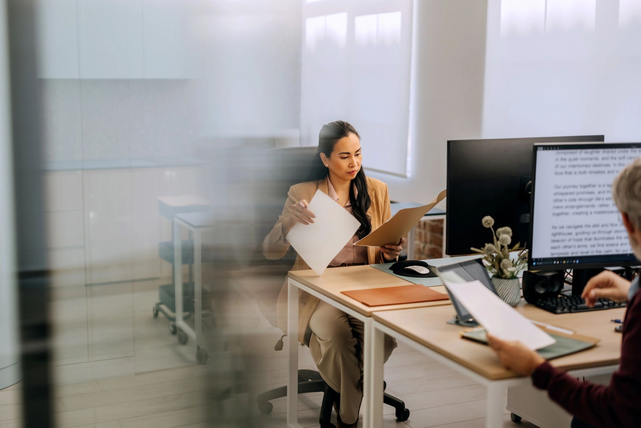 Financial professional reviewing documents in an office